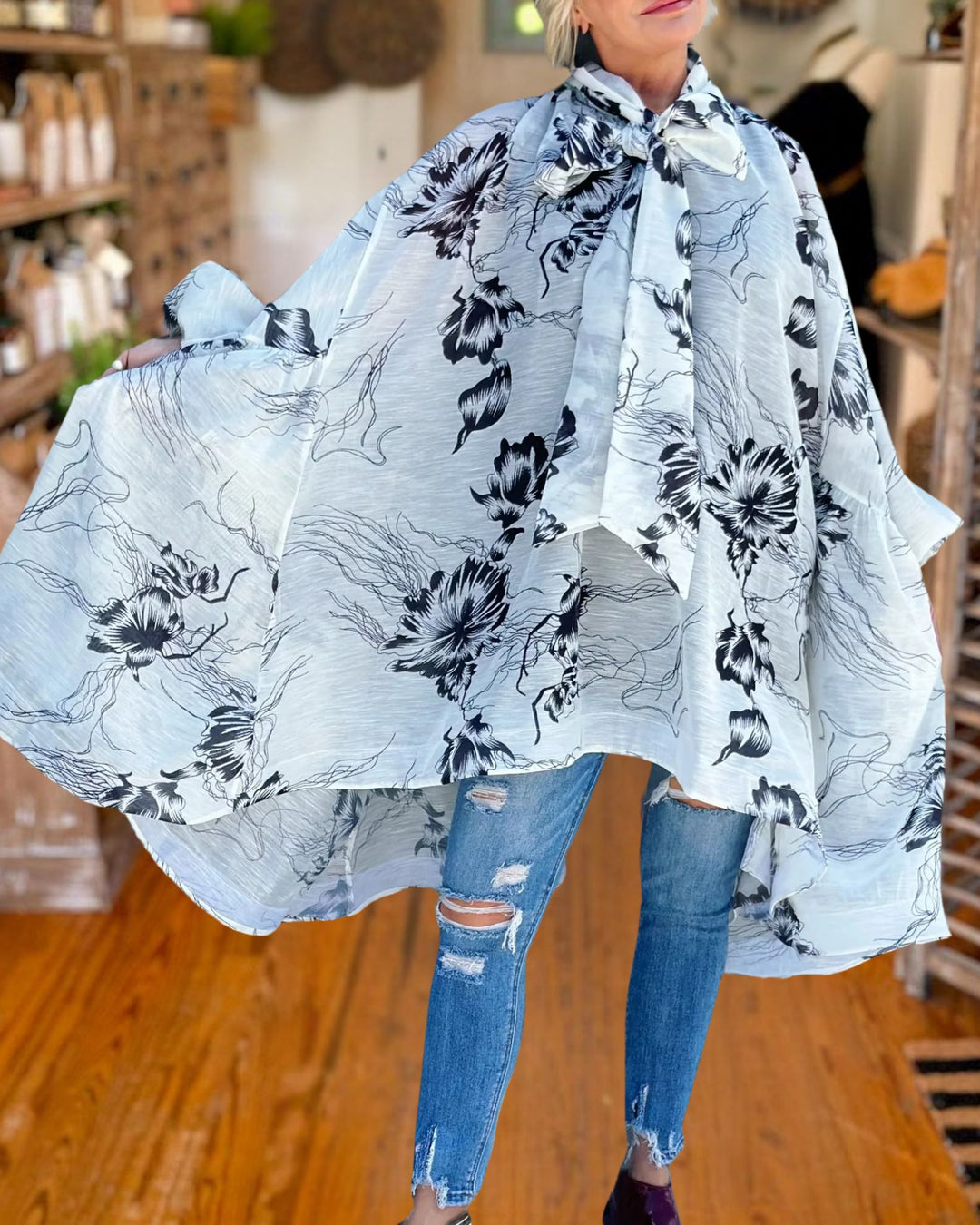 Elegant Floral Tie Neck Cape Dress flowy hem view