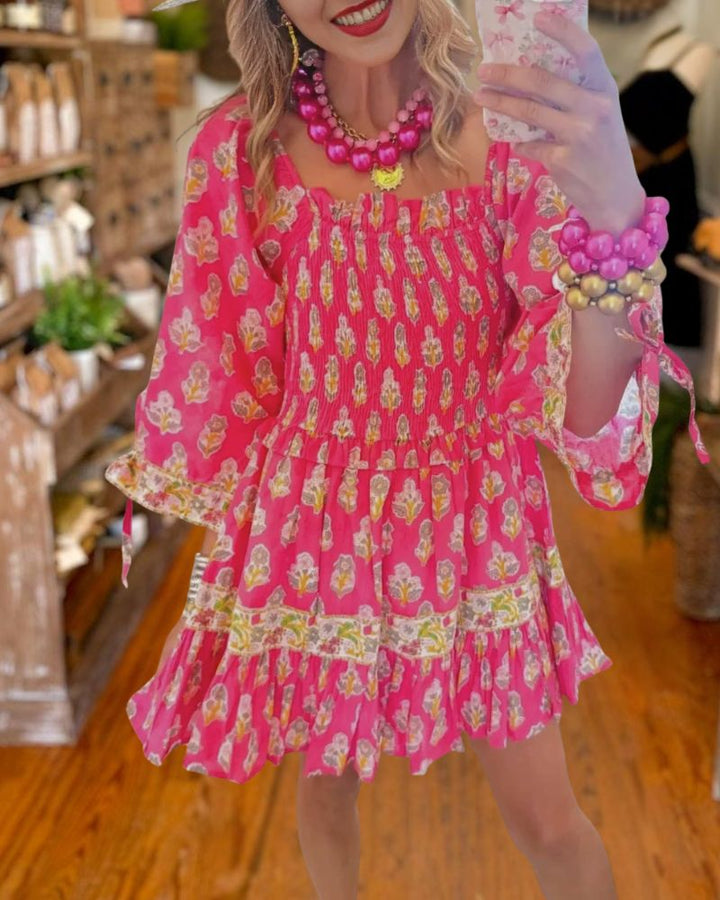Romantic Pink Smocked Floral Mini Dress front view